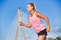 Portrait of young attractive woman running in park Royalty Free Stock Photo