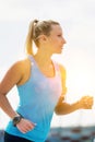 Portrait of young attractive woman running in park Royalty Free Stock Photo