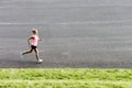 Portrait of young attractive woman running in park Royalty Free Stock Photo