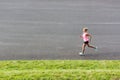 Portrait of young attractive woman running in park Royalty Free Stock Photo