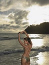 Portrait of young attractive woman wearing bikini while posing on the beach Royalty Free Stock Photo