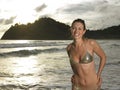 Portrait of young attractive woman wearing bikini while posing on the beach Royalty Free Stock Photo