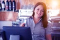 Waiter girl working with pos terminal or cashbox at cafe. People and service concept Royalty Free Stock Photo