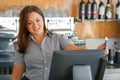 Waiter girl working with pos terminal or cashbox at cafe. People and service concept Royalty Free Stock Photo