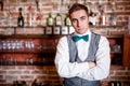 Portrait of young bartender in bar or nightclub