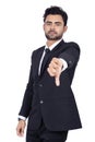 Portrait of a young bearded Indian businessman showing thumb down against a white background Royalty Free Stock Photo