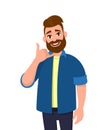 Portrait of young bearded man making showing phone or call me gesture with hand fingers shaped like telephone. Trendy person.