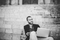 Portrait of young bearded man using his laptop Royalty Free Stock Photo