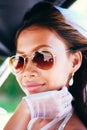 Portrait of a young beautiful Asian bride with sunglasses on her wedding day