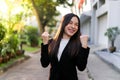 Portrait of Young beautiful Asian business woman felling happy or success working