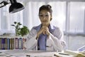 Asian female doctor looking at camera in medical office, having online consultation with patient. Young female doctor Royalty Free Stock Photo