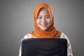 Muslim Woman Holds Laptop Royalty Free Stock Photo