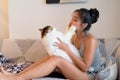 Young beautiful Asian woman kissing Persian cat at home Royalty Free Stock Photo