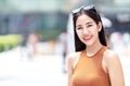 Portrait of young beautiful asian woman, blogger, vlogger or stylish fashion smiling and looking at camera wearing off shoulder Royalty Free Stock Photo