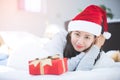 Portrait of young beautiful asian woman with christmas present . Royalty Free Stock Photo