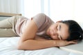 Portrait young of beautiful Asian woman sleep on the white bed in the modern bedroom Royalty Free Stock Photo