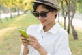 Portrait of young beautiful asian woman and smart phone in hand Royalty Free Stock Photo