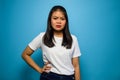 Portrait of Young beautiful asian women wearing white T-shirt with blue background