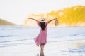 Portrait young beautiful asian woman walk smile and happy on the beach sea and ocean Royalty Free Stock Photo