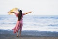 Portrait young beautiful asian woman walk smile and happy on the beach sea and ocean Royalty Free Stock Photo