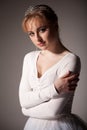 Portrait of young beautiful blond ballerina woman in white tutu and black top over white background Royalty Free Stock Photo