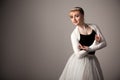 Portrait of young beautiful blond ballerina woman in white tutu and black top over white background Royalty Free Stock Photo