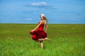 Portrait of a young beautiful blonde woman in red dress Royalty Free Stock Photo