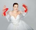 Portrait of young beautiful bride with red shoes Royalty Free Stock Photo