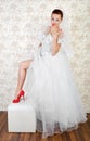 Portrait of young beautiful bride in shoes Royalty Free Stock Photo