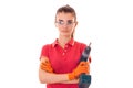 Portrait of young beautiful brunette builder girl makes renovation with drill in hands isolated on white background Royalty Free Stock Photo