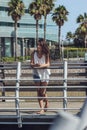 Portrait of young beautiful brunette girl listening to the music on the phone Royalty Free Stock Photo