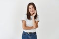 Portrait of young beautiful brunette girl smiling looking at camera over white background Royalty Free Stock Photo