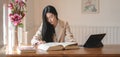 Portrait of young beautiful businesswoman working on her project in comfortable office Royalty Free Stock Photo