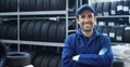 Portrait of a young beautiful car mechanic in a car workshop, in the background of service. Concept: repair of machines, fault dia Royalty Free Stock Photo