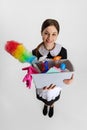 Portrait of young beautiful Caucasian woman with cleaning equipment bottles isolated over white background Royalty Free Stock Photo