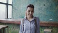 Portrait of young beautiful caucasian woman in modern coworking space. Businesswoman looking at camera, smiling, Royalty Free Stock Photo