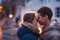 Portrait of young beautiful couple kissing in an autumn rainy day. Royalty Free Stock Photo