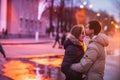 Portrait of young beautiful couple kissing in an autumn rainy day. Royalty Free Stock Photo