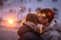 Portrait of young beautiful couple kissing in an autumn rainy day. Royalty Free Stock Photo