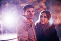 Portrait of young beautiful couple kissing in an autumn rainy day. Royalty Free Stock Photo