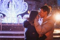 Portrait of young beautiful couple kissing in an autumn rainy day. Royalty Free Stock Photo