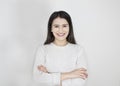 Portrait of young beautiful cute cheerful girl smiling looking at camera over white background. Royalty Free Stock Photo