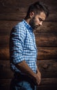 Portrait of young beautiful fashionable man against wooden wall. Royalty Free Stock Photo