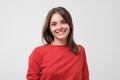 Portrait of young beautiful gcaucasian woman in red t-shirt cheerfuly smiling looking at camera. Royalty Free Stock Photo