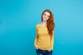 Portrait of young beautiful ginger woman with freckles cheerfuly smiling looking at camera. Isolated on pastel blue Royalty Free Stock Photo