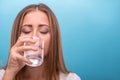 Portrait of young beautiful girl drinking clean Royalty Free Stock Photo