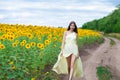 Portrait of a young beautiful girl in a field of sunflowers Royalty Free Stock Photo