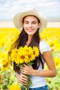 Portrait of a young beautiful girl in a field of sunflowers Royalty Free Stock Photo