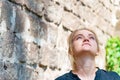 Portrait of a young and beautiful girl near a brick wall. Royalty Free Stock Photo