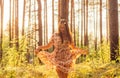 Portrait of young beautiful girl in summer dress in forest that dancing Royalty Free Stock Photo